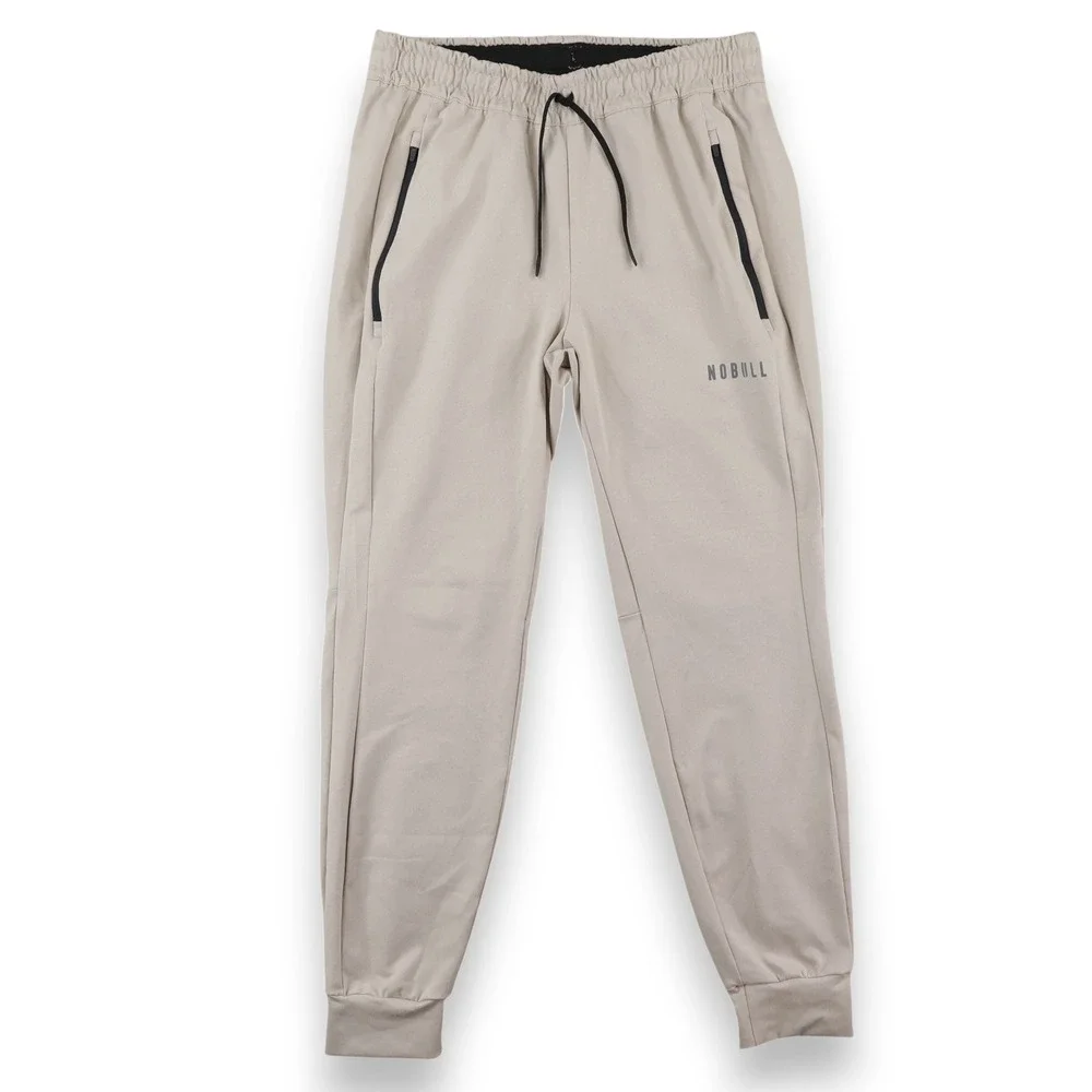 NOBULL Jogger Pants Mens Medium Tan Zipper Pockets Tapered Training Sweatpants